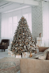 Fototapeta premium The image is of a Christmas tree with lights in a room. 5434