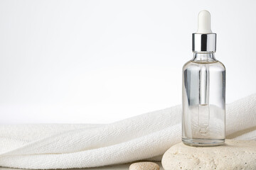 Essential serum Oil in cosmetic bottles with dropper
