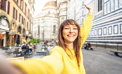 Tourist female visiting Florence cathedral, Italy - Traveller girl taking selfie portrait in front of Il Duomo di Firenze or Basilica di Santa Maria del Fiore - Italian touristic attraction concept - obrazy, fototapety, plakaty