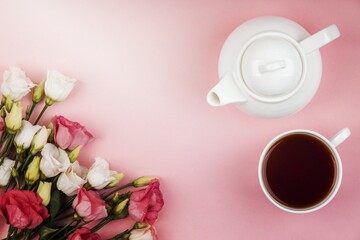 top view beautiful roses arrangement with teapot cup tea