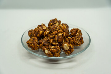 A Plate of Peanut Ladoo for Makar Sankranti which is Peantus dipped in Sweet Jaggery gud in Nepal and India