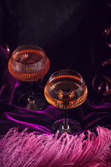 Extravagant glamour background with glass of sparkling wine for love party at muffled light. Beautiful romantic burlesque place for valentines holiday