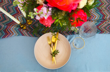 Table setting in vintage style is decorated with flowers