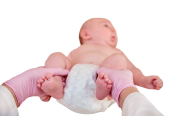 The doctor does gymnastics and massage to a newborn baby, isolated on a white background. Nurse in uniform doing warm-up exercises to the child. Kid aged two months
