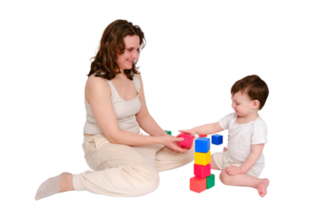 Happy baby with mother play educational toys on studio, isolated on white background. Portrait of a smiling child with mom. Kid about two years old (one year nine months)