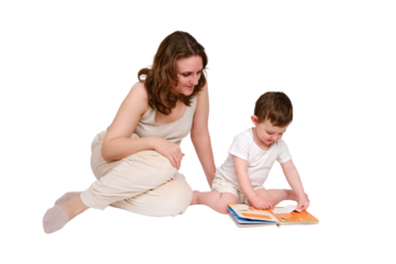 Happy baby with mother reading a book on studio, isolated on white background. Portrait of a smiling child with mom, isolated on white background. Kid about two years old (one year nine months)