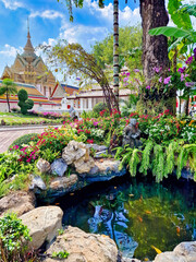 Amazing temple in Bangkok, Thailand, fountain with beautiful flowers