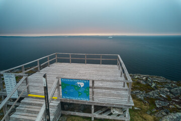 The platform atop Brimstone Head considered one of the four corners of the world as seen from an aerial drone view with the North Atlantic and icebergs in the background