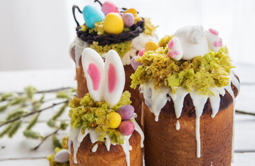 Paska - Easter Eve sweet bread with icing decorated with eatable "moss" still life with willow. Popular dessert during Eastern Orthodox Easter. Old cultures traditions and healthy eating concept image