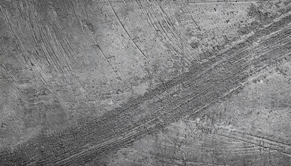 Close-up of a textured concrete surface in grayscale, showcasing intricate patterns and lines. Ideal for backgrounds or overlays.