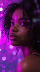 Obraz na płótnie Canvas Beautiful afroamerican woman in purple light under raindrops. Fashion portrait, black, cyberpunk vaporwave portrait. Party luxury portrait with water and fashion setup