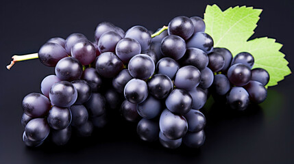 Fototapeta premium Fresh black grapes on white background