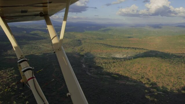 Ariel of scrublands from a light aircraft during the afternoon in Kenya.