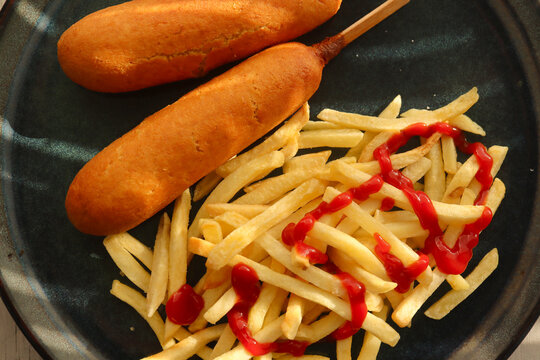 Corndogs and French Fries with ketchup 