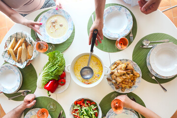 Close up of the table fish soup, salad and chicken