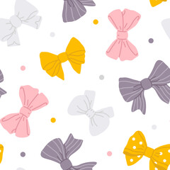 Vector seamless background pattern with bows and dots for surface pattern design 