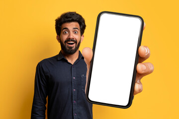 Excited Indian Man Showing Big Phone With White Blank Screen