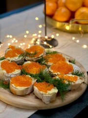 Festive candlelight dinner with shrimp and caviar sandwiches