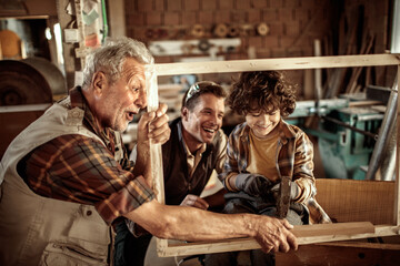 Grandfather, Father, and Son in a Woodworking Workshop