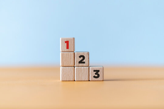 Set work priority, arrange to do list. Task priority and management concept. Activity order of priority. Wooden Cube blocks with number first, second and third with copy space