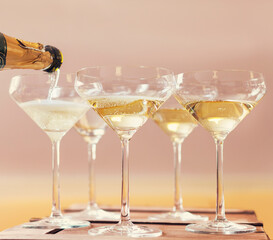 Champaign being pored into glasses