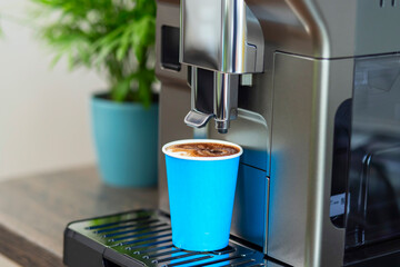 Automatic Coffee Machine Dispensing Espresso into Cup