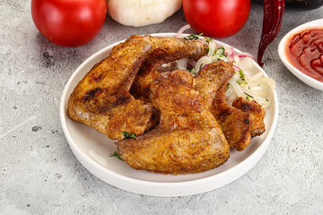 Grilled chicken wings with sauce