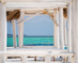 Seascape view background from wooden frame on the beach, summer concept, wonderful landscape nature view, luxury resort.