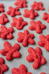 traditional Chinese New Year red sand cookie, symbolizing luck and happiness. cookies are baked during Chinese New Year celebration. captures intricate details of festive, representing good fortune