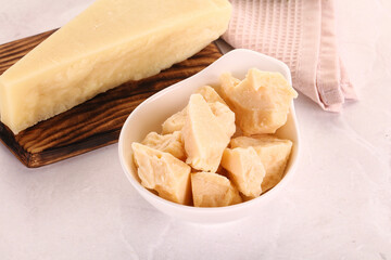 Chopped Italian hard parmesan cheese