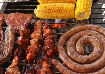 meat on the grill. South African braai. Boerewors and mielies 