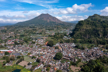 Aerial view of a mountainous landscape with a Batur village