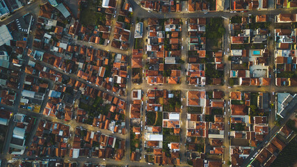 top view looking down of many houses during sunset time in Bueno Brandao, Minas Gerais, Brazil
