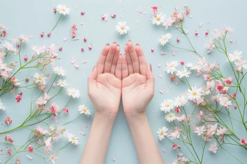Foto op Aluminium Woman hands among the spring flowers. Floral background with beautiful female hands. Natural cosmetics and skin care concept © Lazy_Bear