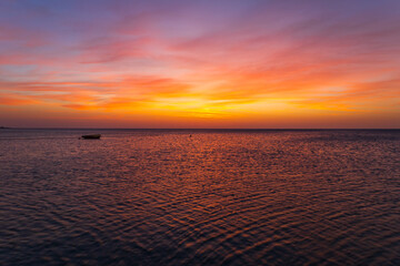 Landscape by the sea in Greece on the island of Rhodes. Sunrise, dramatic clouds. Beautiful background.