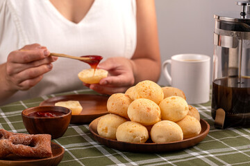 Typical Brazilian Breakfast. Humanized shoot. Pão de Queijo. Guava cream.