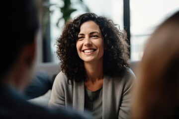 Middle aged female therapist doing group therapy at home