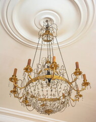 A beautiful elegant antique chandelier with crystal pendants