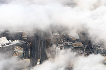 Fototapeta na wymiar Aerial photograph of suburban areas of Washington DC as seen through clouds from my airplane window