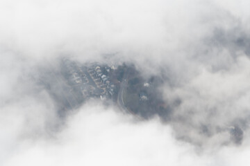 Aerial photograph of suburban areas of Washington DC as seen through clouds from my airplane window