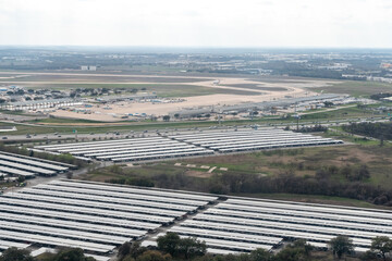 Aerial view of Austin Bergstrom International Airport featuring Covered Parking areas, the Cargo Hangers and Route 71