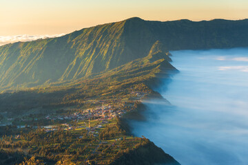 Mount Bromo in beautiful sunrise, with sea of cloud. An active volcano in Java, Indonesia - obrazy, fototapety, plakaty