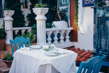 Outdoor cafe or restaurant tables in the old city of Kas, Turkey.