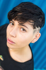 Androgynous rocker woman on the street using her smartphone
