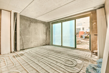 a living room being remodeled with a large window
