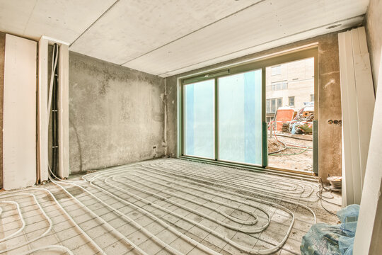 a living room being remodeled with a large window