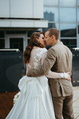 Fototapeta premium bride and groom first meeting on the roof of skyscraper