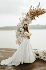 Fototapeta na wymiar bride against the background of a yellow sunset