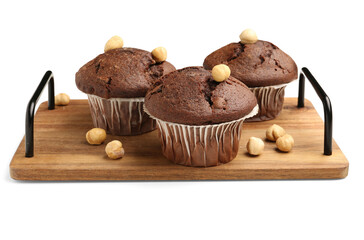 Wooden board with tasty chocolate cupcakes isolated on white background