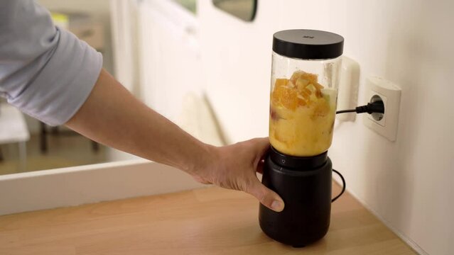 Man Making A Fruit Smoothie